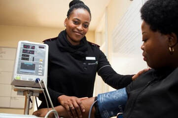  A woman has her blood pressure measured